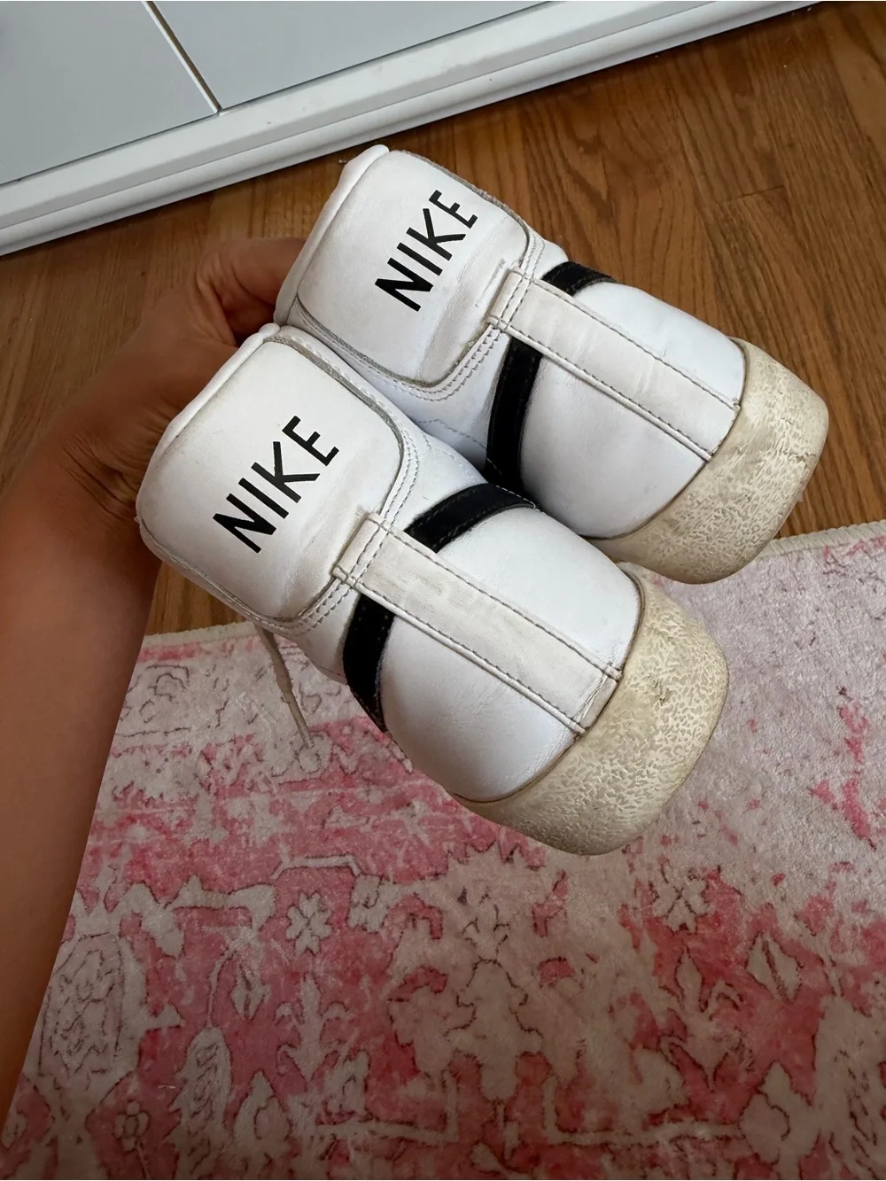 Nike White High-Top Sneakers with Black Swoosh